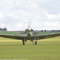 Buy canvas prints of RAF Spitfire taxiing by Keith Campbell