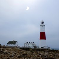 Buy canvas prints of  Eclipse over Portland Lighthouse in Dorset by JCs by JC studios LRPS ARPS