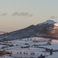 Buy canvas prints of Holy Mountain Skirrid Winters Snowy Dawn 8307 by simon powell