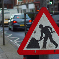 Buy canvas prints of Street sign digging busy road by Marc Reeves