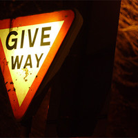 Buy canvas prints of Give way sign at night by Marc Reeves