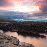 Buy canvas prints of Bamburgh Lighthouse by Neil Coleran