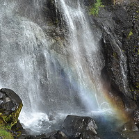 Buy canvas prints of Rainbow at the bottom of a waterfall at Skaftafell by Jutta Klassen