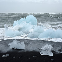 Buy canvas prints of Glacier ice floes on a black beach by Jutta Klassen