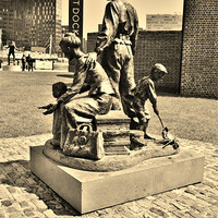 Buy canvas prints of The Emigrants Statue Liverpool by Sandra Buchanan