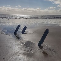 Buy canvas prints of Old pipe supports on Jersey Marine Beach by HELEN PARKER