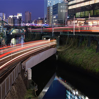 Buy canvas prints of Light Trails Weave Through Tokyo by Duane Walker