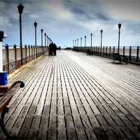Buy canvas prints of Along the Pier by Jon Fixter