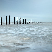 Buy canvas prints of Groins at Low tide by Jon Fixter