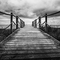 Buy canvas prints of Over the bridge to the sea in mono by Ian Johnston  LRPS