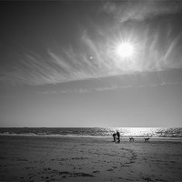 Buy canvas prints of A Winters Beach - Man & Dog by Ian Johnston  LRPS