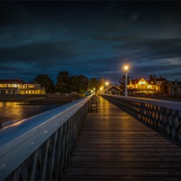 Buy canvas prints of Night - Time Pier towards the shore by Ian Johnston  LRPS