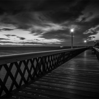 Buy canvas prints of Night Time Pier Mono by Ian Johnston  LRPS