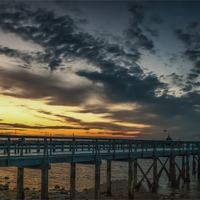 Buy canvas prints of Sunset at Yarmouth over the pier by Ian Johnston  LRPS