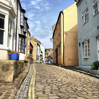 Buy canvas prints of Ye Old Cobbled High Street by Marie Castagnoli