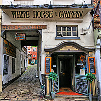 Buy canvas prints of The White Horse & Griffin Inn by Marie Castagnoli