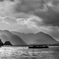 Buy canvas prints of Crossing Derwentwater under stormy skies by Ian Duffield