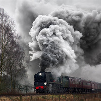 Buy canvas prints of A historic steam locomotive produces volcanic exha by Ian Duffield