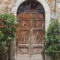 Buy canvas prints of Antiquated Tuscan doorway by Ian Duffield