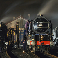 Buy canvas prints of  Steam locomotives receive attention on shed at ni by Ian Duffield