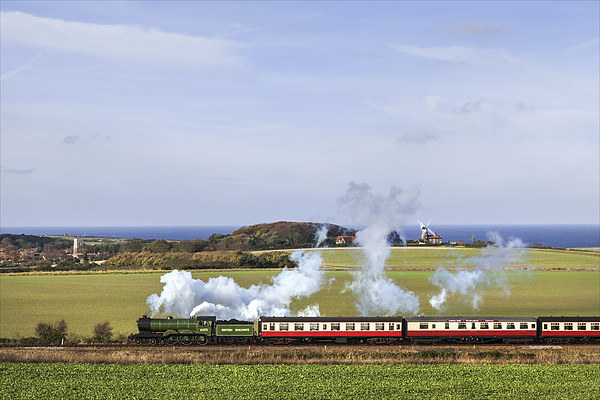 Steam train passing Weybourne.  Picture Board by Ian Duffield