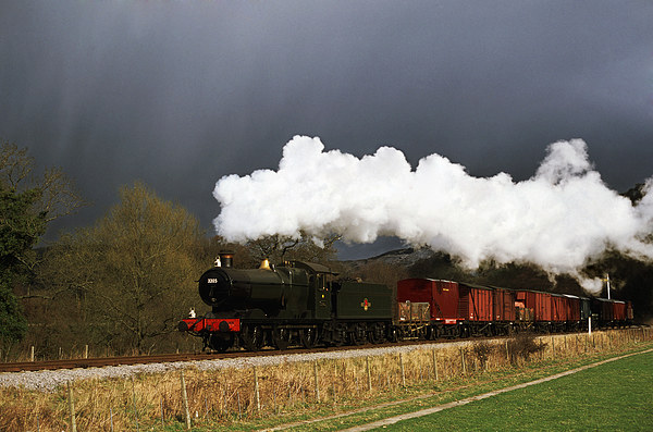 Goods train running ahead of a snowstorm  Picture Board by Ian Duffield