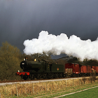 Buy canvas prints of Goods train running ahead of a snowstorm  by Ian Duffield