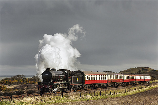 Steam train and storm clouds on the Norfolk Coast  Picture Board by Ian Duffield