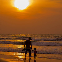 Buy canvas prints of Father and son walking at the beach on Fathers Day by Telmo Zaldivar Jr