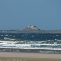 Buy canvas prints of Lindisfarne Castle from Bamburgh Beach by Ursula Keene