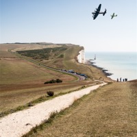 Buy canvas prints of Lancaster & Spitfire over Beachy Head by Robert  Radford