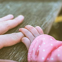 Buy canvas prints of Holding daddies finger by john mayo