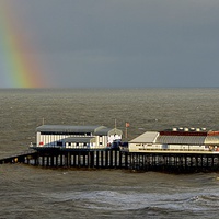 Buy canvas prints of  Rainbow over the pier by Gordon Holmes