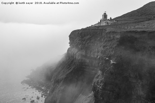 Whitby Lighthouse as the fog rolls in Picture Board by keith sayer