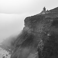 Buy canvas prints of Whitby Lighthouse as the fog rolls in by keith sayer