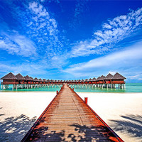 Buy canvas prints of Water Villas at Resort Olhuveli. Maldives by Jenny Rainbow