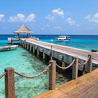 Buy canvas prints of Pier Into Blue by Jenny Rainbow