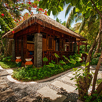 Buy canvas prints of Aaramu Spa Hideaway in Tropical Garden. Maldives by Jenny Rainbow