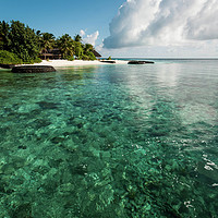 Buy canvas prints of Emerald water of the Maldivian coral reef near isl by Jenny Rainbow