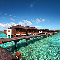 Buy canvas prints of Luxury Water Villas of Maldivian Resort by Jenny Rainbow