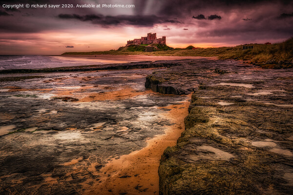 Majestic Sunset over Bamburgh Castle Picture Board by richard sayer