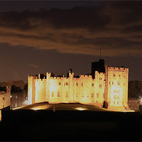 Buy canvas prints of Alnwick Castle at night by Kevin Duffy