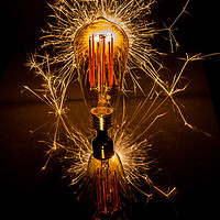 Buy canvas prints of Sparkling Vintage Light Bulb by Kevin Duffy