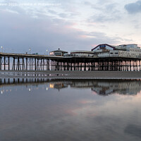 Buy canvas prints of Pastel Sunset reflection at North Pier Blackpool by Gary Kenyon