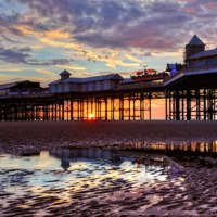 Buy canvas prints of Sunset Pier Blackpool by Gary Kenyon