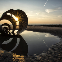 Buy canvas prints of  Starburst Sun at Mary's Shell - Cleveley's by Gary Kenyon
