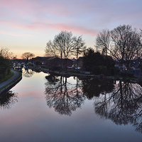 Buy canvas prints of Reflections in the Lancaster Canal by Gary Kenyon