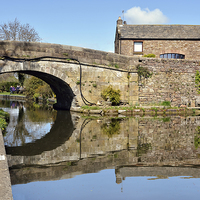 Buy canvas prints of Reflections on the Lancaster Canal At Galgate by Gary Kenyon