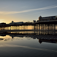 Buy canvas prints of Sunset North Pier Reflections by Gary Kenyon