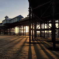 Buy canvas prints of Long Shadows Under The Pier by Gary Kenyon